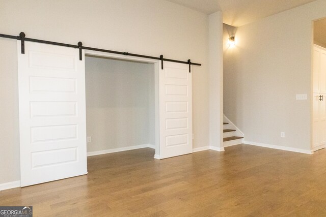 unfurnished living room featuring a fireplace, light wood-type flooring, and ceiling fan