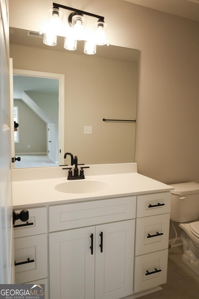 full bathroom featuring washtub / shower combination, vanity, and toilet