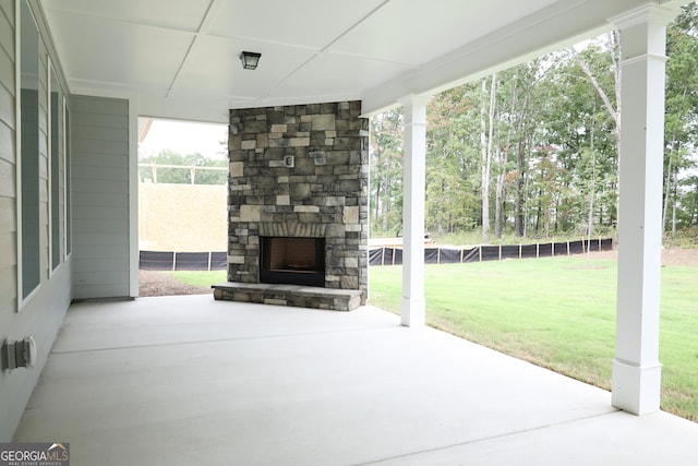 view of patio with an outdoor stone fireplace