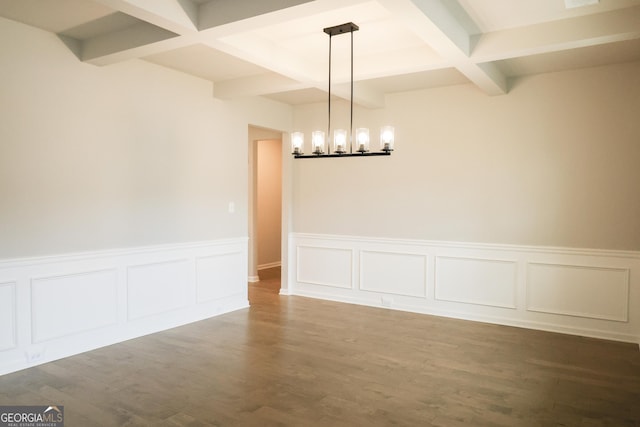 unfurnished dining area with beam ceiling, hardwood / wood-style floors, and coffered ceiling