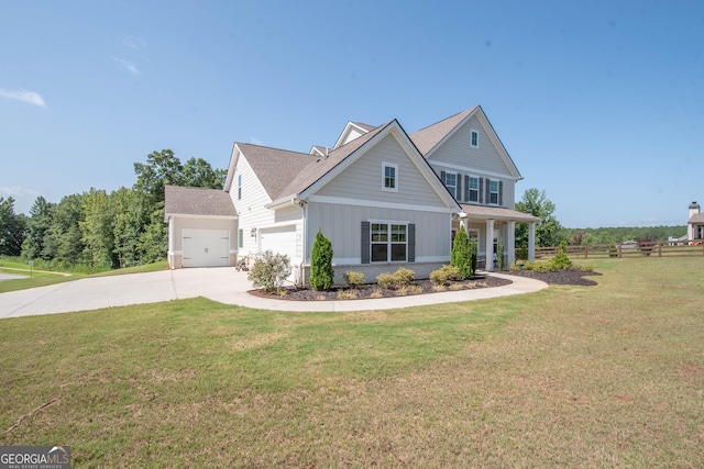 view of front facade with a front yard and a garage