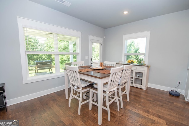 dining space featuring dark hardwood / wood-style flooring