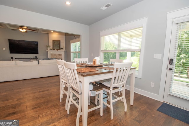 dining space featuring dark hardwood / wood-style flooring, a wealth of natural light, and ceiling fan