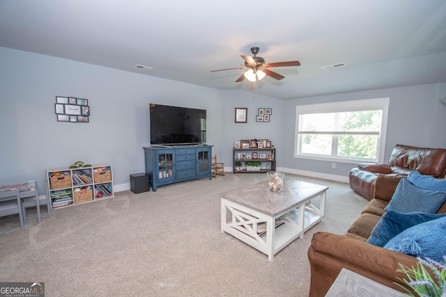 carpeted living room featuring ceiling fan