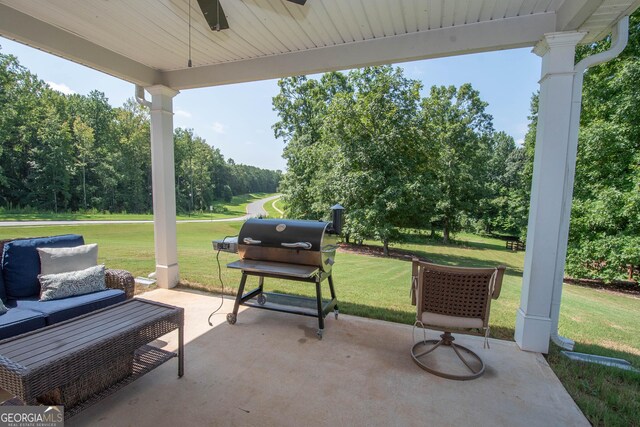 view of patio with ceiling fan and grilling area