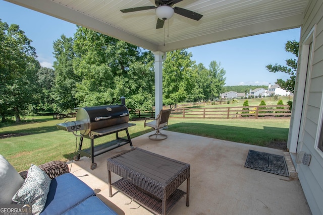 view of patio featuring a grill, an outdoor hangout area, a ceiling fan, and fence