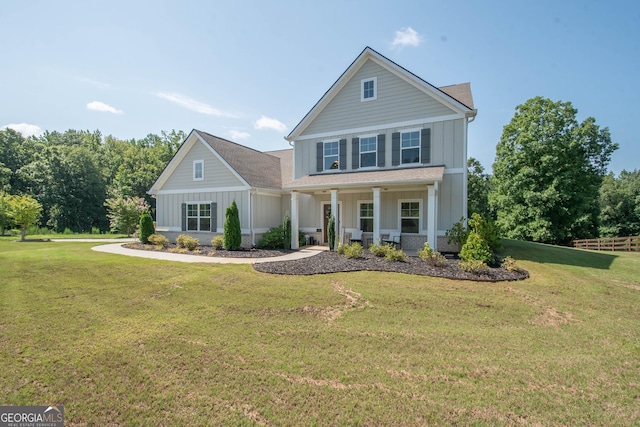 view of front of property featuring a porch and a front lawn