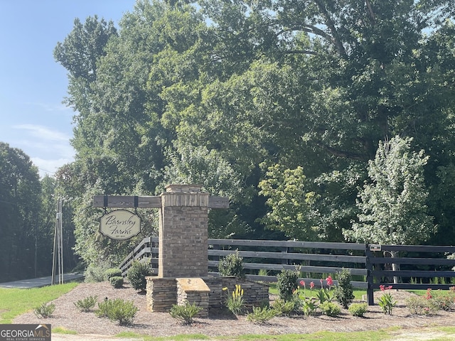 community sign with fence