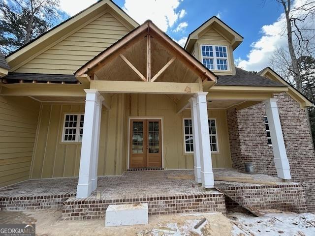 doorway to property with a porch