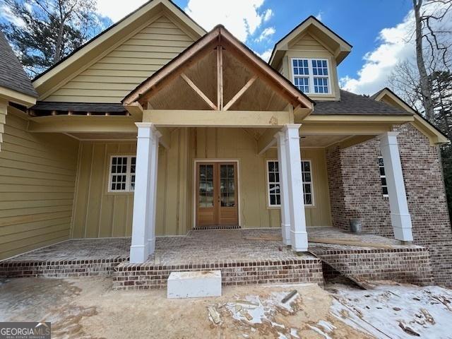 doorway to property with french doors and covered porch