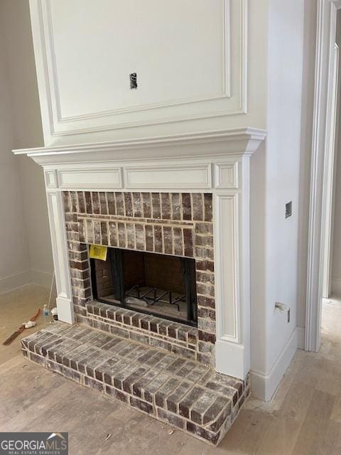 room details featuring hardwood / wood-style floors and a fireplace