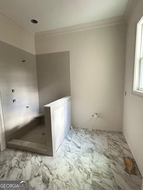 bathroom featuring crown molding and a shower