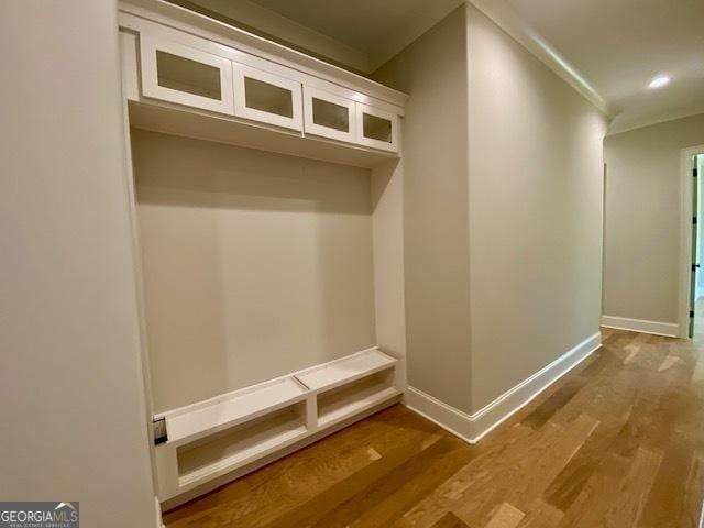 mudroom featuring baseboards, recessed lighting, wood finished floors, and crown molding