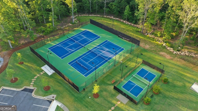 birds eye view of property with a forest view