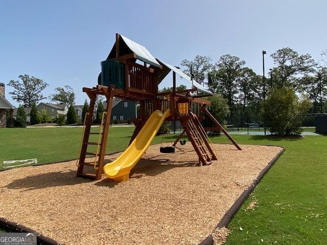 communal playground featuring a yard