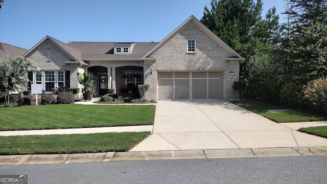 view of front facade with a garage and a front yard