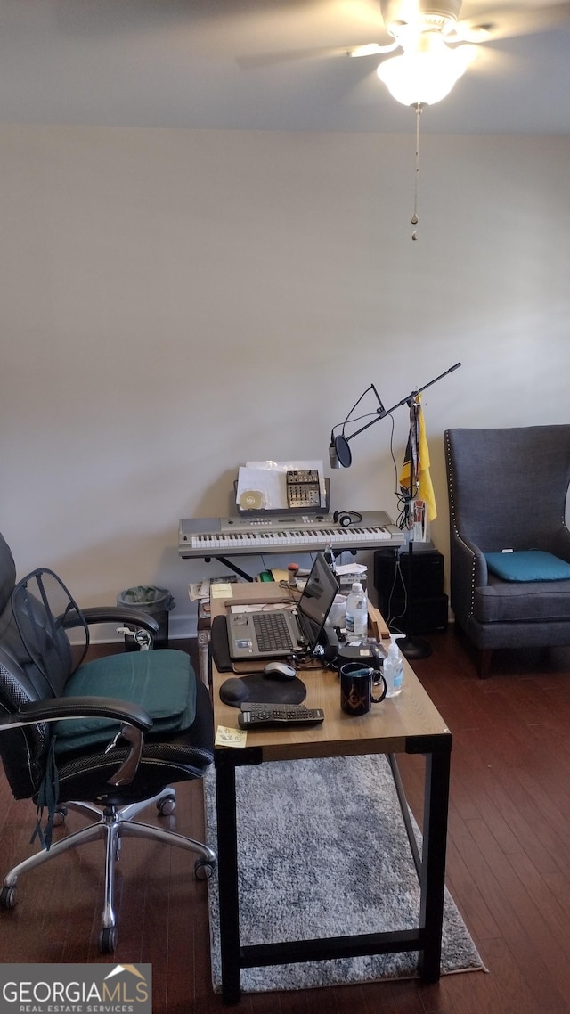 home office with dark wood-type flooring