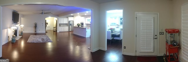 foyer entrance featuring dark hardwood / wood-style floors and ceiling fan