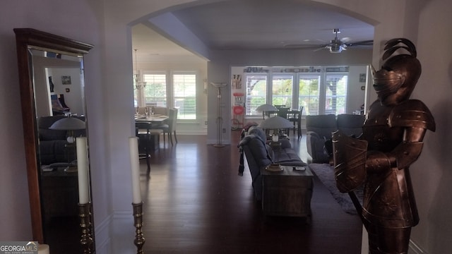 living room featuring dark hardwood / wood-style flooring and ceiling fan