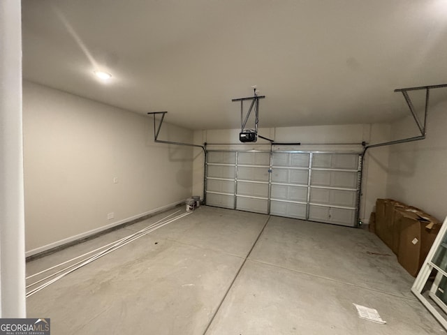 garage featuring a garage door opener