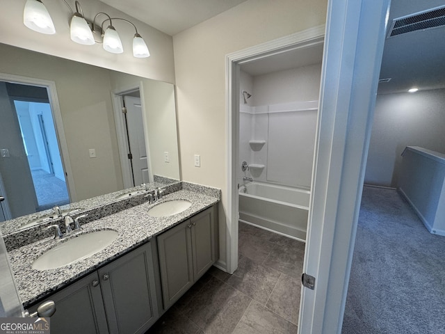 bathroom with vanity and bathtub / shower combination