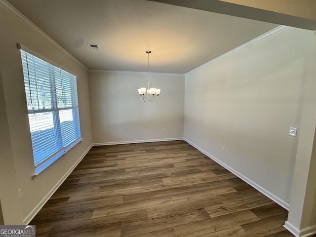 unfurnished dining area with a chandelier, dark hardwood / wood-style floors, and ornamental molding