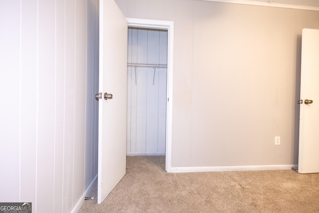 unfurnished bedroom featuring light colored carpet