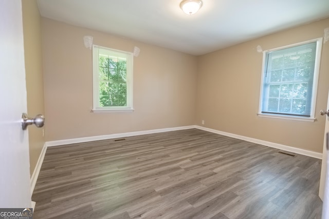 empty room featuring hardwood / wood-style flooring