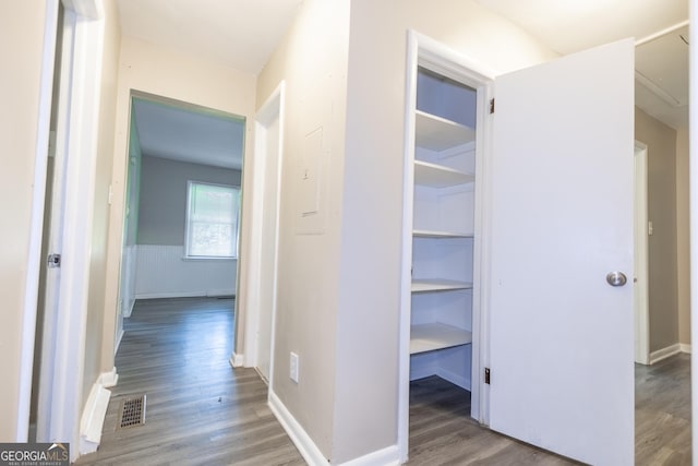 hall with wood-type flooring