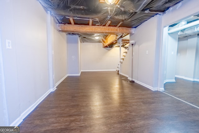 basement with dark wood-type flooring