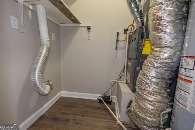 utility room with gas water heater