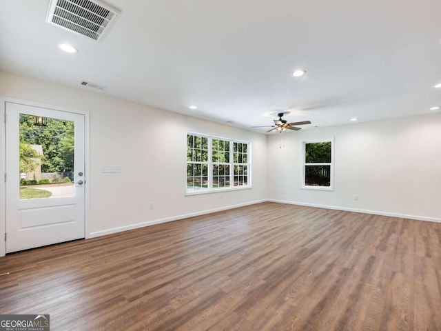 unfurnished living room featuring ceiling fan and wood-type flooring