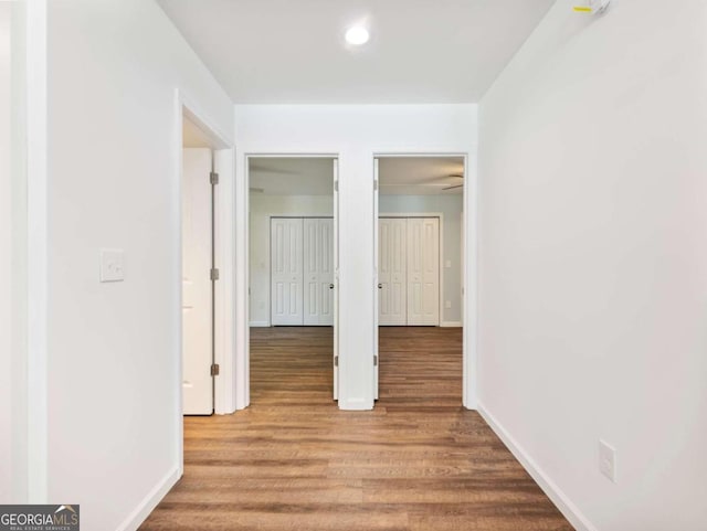 hallway with light hardwood / wood-style flooring