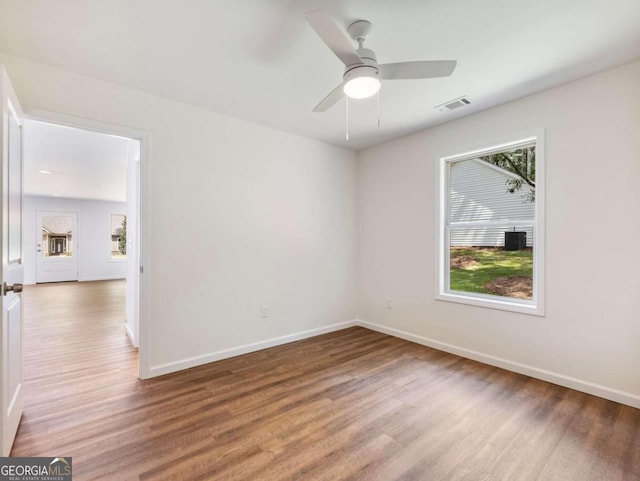 unfurnished room featuring ceiling fan and hardwood / wood-style floors