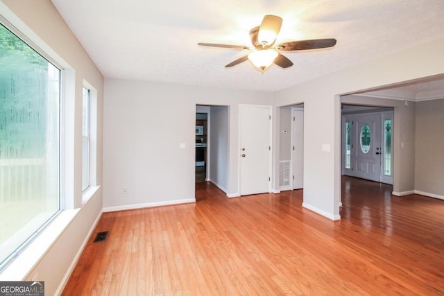 interior space with ceiling fan and hardwood / wood-style flooring