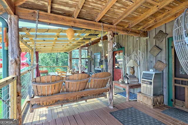 unfurnished sunroom with wooden ceiling and lofted ceiling