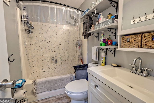 bathroom with vanity, hardwood / wood-style flooring, and toilet