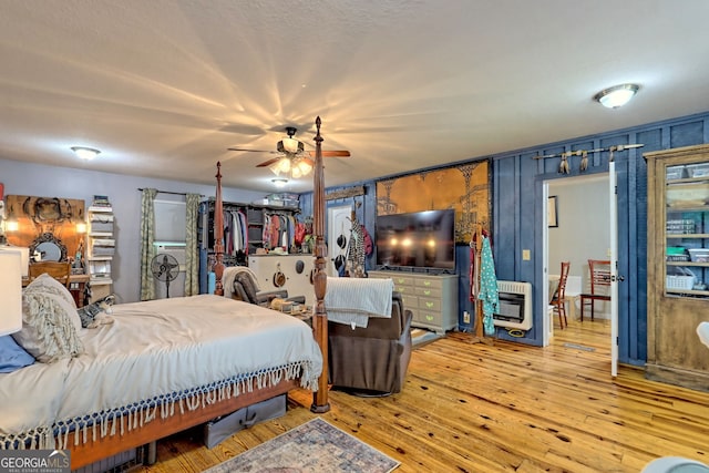 bedroom featuring ceiling fan and light hardwood / wood-style floors