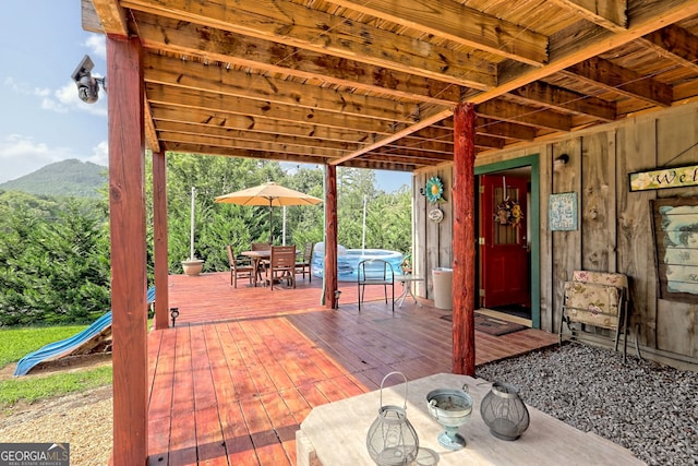 view of patio with a deck with mountain view