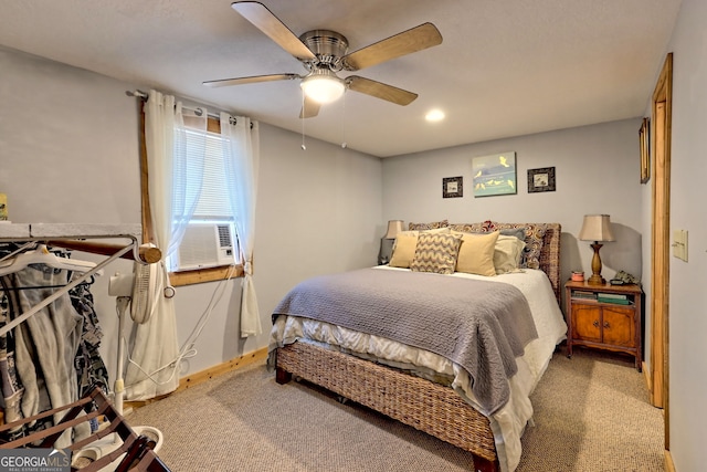 bedroom featuring carpet, ceiling fan, and cooling unit