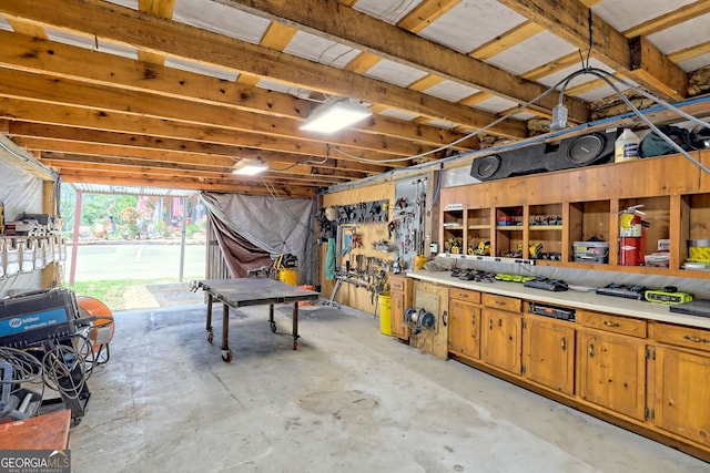 garage with a workshop area