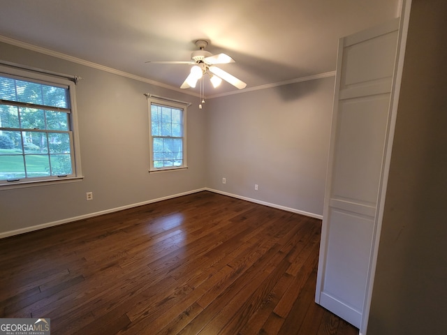 unfurnished room with ceiling fan, dark wood-type flooring, and crown molding