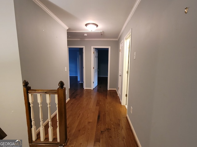 corridor with hardwood / wood-style floors and crown molding