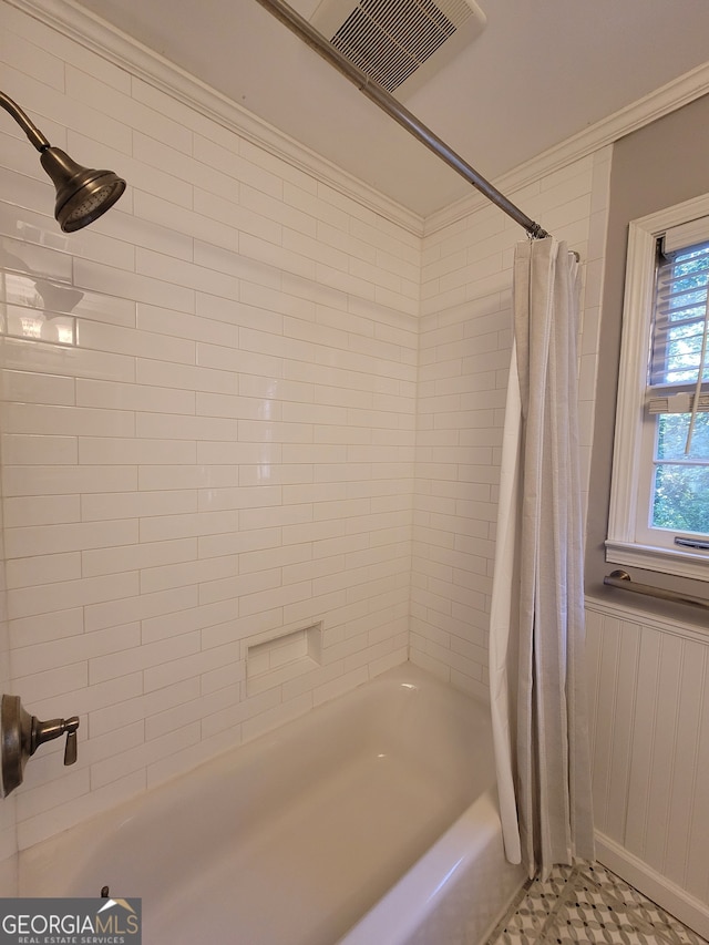 bathroom featuring shower / bathtub combination with curtain and tile patterned flooring