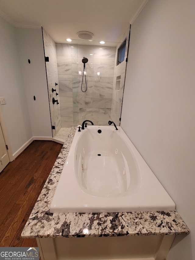 bathroom featuring crown molding and hardwood / wood-style floors