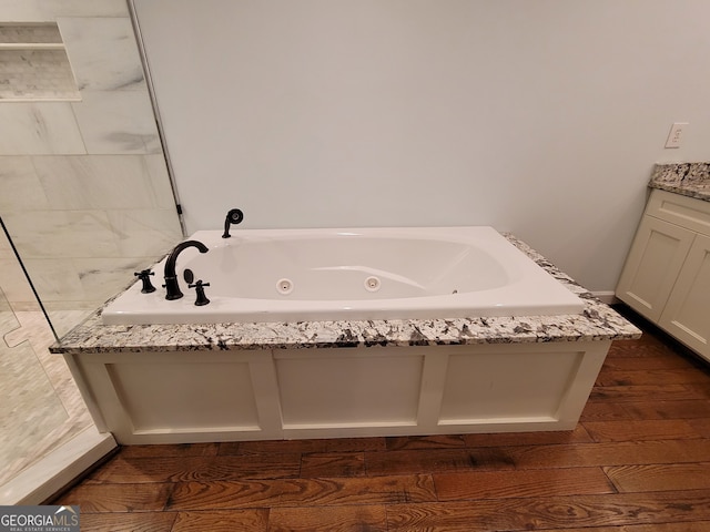 bathroom with vanity and hardwood / wood-style floors