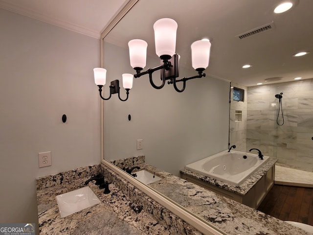 bathroom featuring a notable chandelier, vanity, crown molding, and wood-type flooring