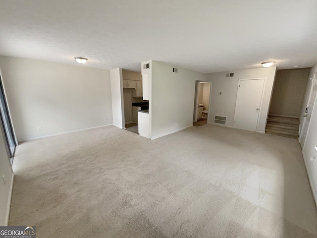 1472 Pine Log Rd NE, Conyers, GA 30012 - spare room featuring light colored carpet and baseboards