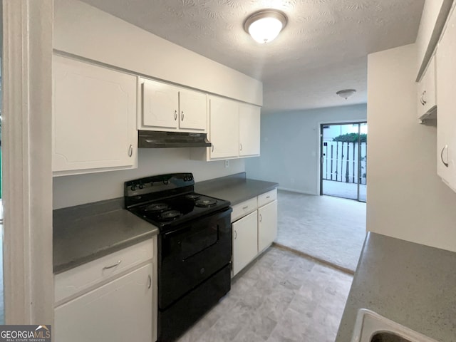 kitchen featuring white cabinetry, light tile patterned floors, a textured ceiling, and black range with electric cooktop