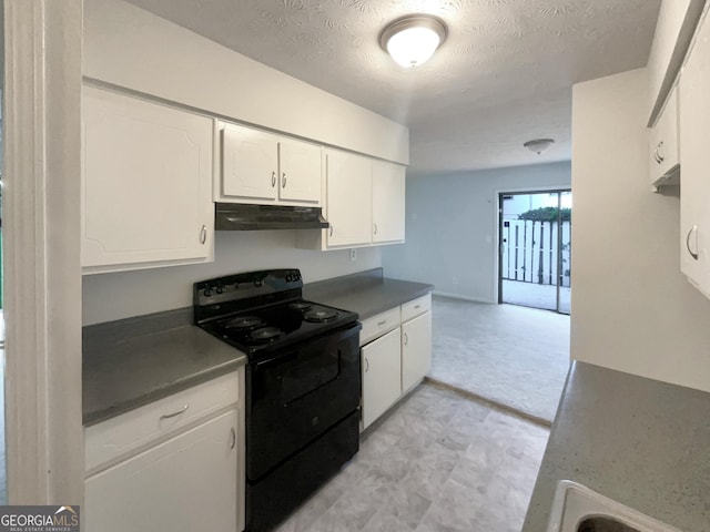 kitchen with white cabinetry, a textured ceiling, and black range with electric cooktop